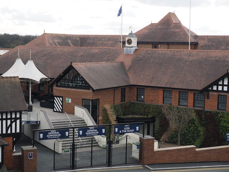 Chester. Cheshire, United Kingdom - 20 March 2024 : The entrance gates to Chester racecourse and 1539 roof terrace